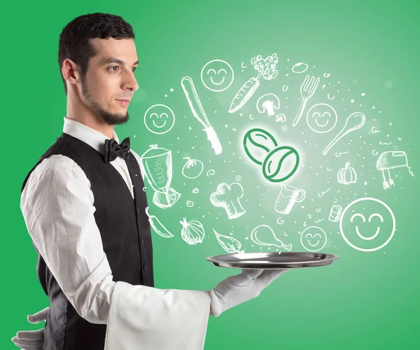 Waiter holding silver tray with food icons above — Stock Photo, Image