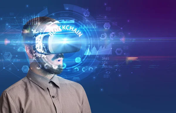 Businessman looking through VR glasses — Stock Photo, Image