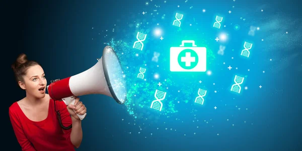 Young person with megaphone and healthcare icon — Stock Photo, Image