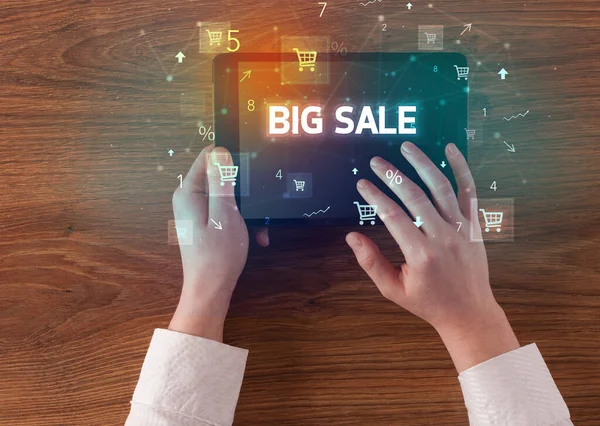 Close-up of a hand holding tablet with shopping inscription — Stock Photo, Image