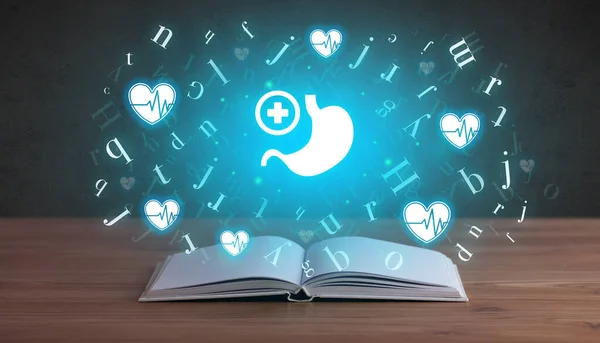 Open medical book with health icons above — Stock Photo, Image