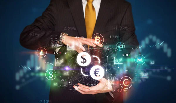 Businessman holding currency symbols — Stock Photo, Image