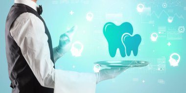 Smokinli yakışıklı garson tepside sağlık ikonu taşıyor.