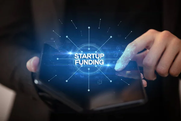 Üzletember kezében egy összecsukható okostelefon, új üzleti koncepció — Stock Fotó