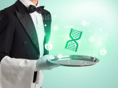 Smokinli yakışıklı garson tepside sağlık ikonu taşıyor.