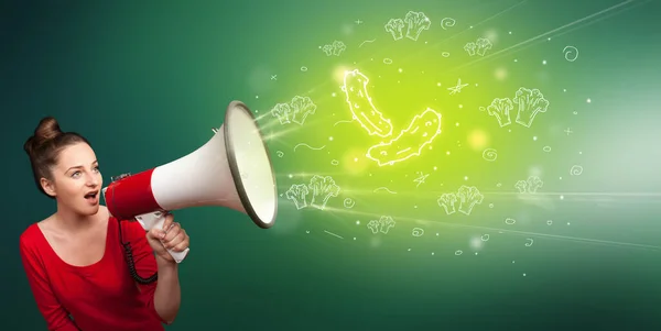 Young person with megaphone and healthy food icon — Stock Photo, Image