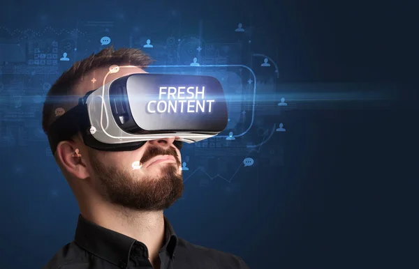 Stock image Businessman looking through Virtual Reality glasses, social media concept