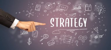 İşletme yazıtlarına işaret eden kırpılmış elin yakın çekimi