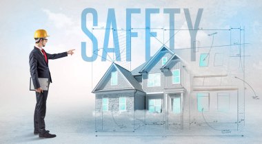 Genç mühendis proje konseptini elinde tutuyor