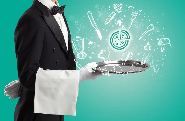 Waiter holding silver tray with food icons above — Stock Photo, Image