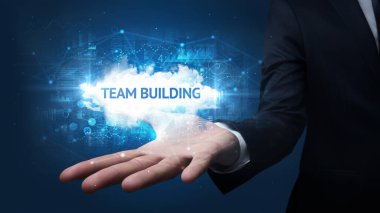 Motivasyon mesajı taşıyan iş adamının eli