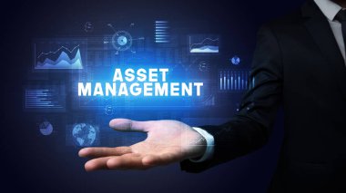 İş adamının elinde ASSET MANAGEMENT yazıtları, iş başarısı konsepti