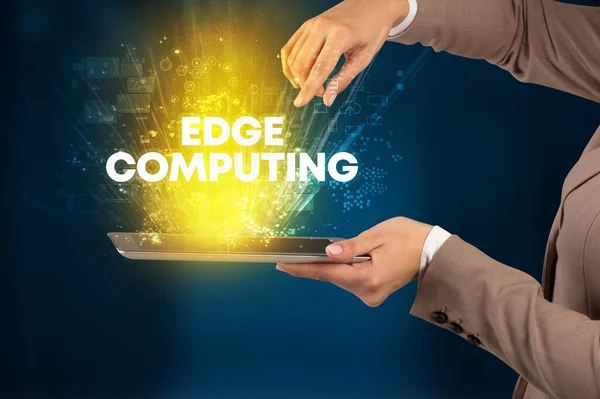 Close-up of a touchscreen with EDGE COMPUTING inscription, innovative technology concept