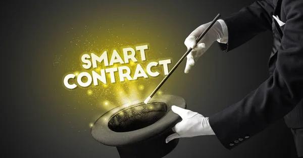 Illusionist is showing magic trick with SMART CONTRACT inscription, new business model concept