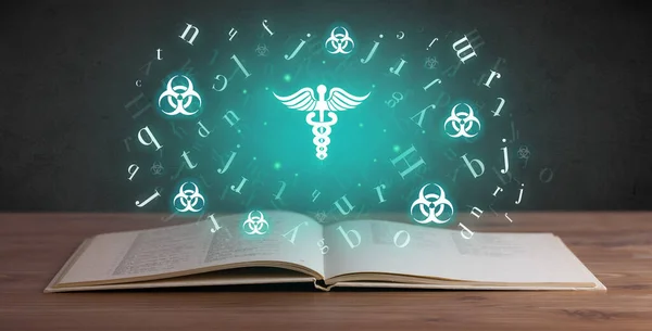 Open medical book with pharmacy icons above, global health concept