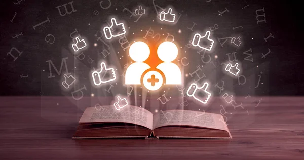 Open book with new friendship icons above, social networking concept