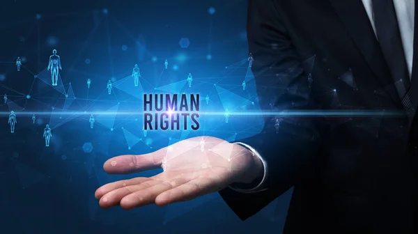 Elegant hand holding HUMAN RIGHTS inscription, social networking concept