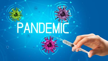 Şırınga, elinde PANDEMIC yazısıyla tıbbi enjeksiyon, koronavirüs aşısı konsepti