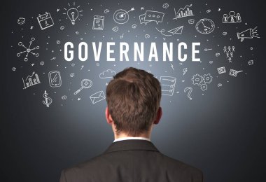 GOVERNANCE yazıtları, modern iş konsepti olan bir işadamının arka görüşü