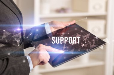 El kapama işlemini SUPPORT yazması, modern iş teknolojisi kavramı kullanan tablet kullanarak yapın