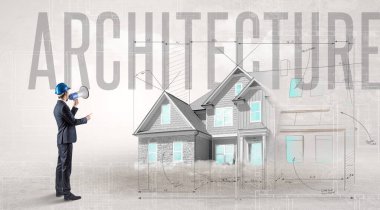 ARCHITECTURE yazıtları ve ev planlama konsepti olan genç bir mühendis elinde