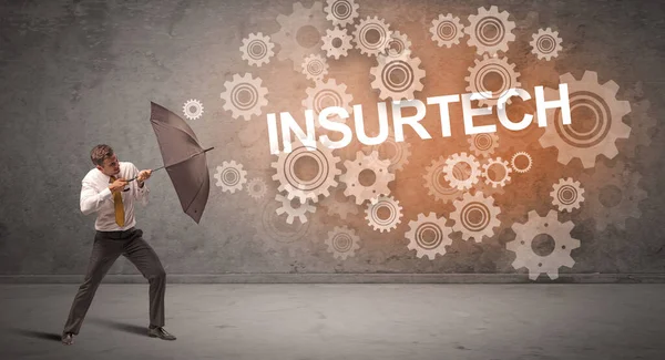 Businessman Defending Umbrella Insurtech Inscription Technology Concept — Stock Photo, Image