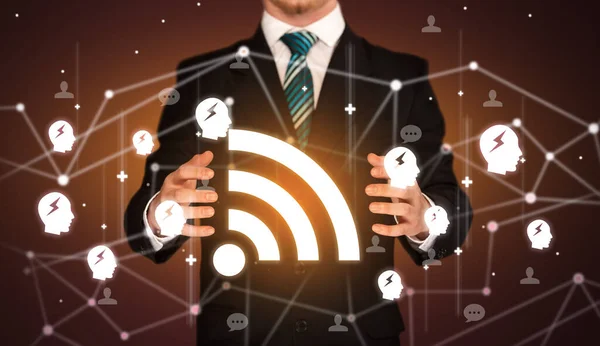 Hand holdig wifi icon around his hands, Social networking concept
