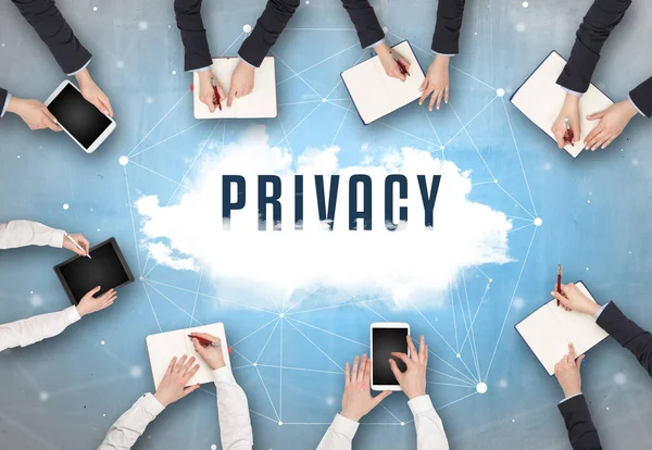 Group of people having a meeting with PRIVACY insciption, web security concept