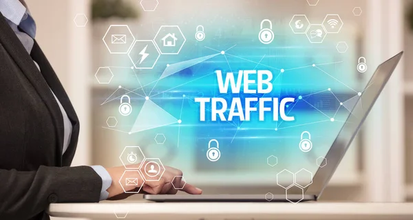 WEB TRAFFIC inscription on laptop, internet security and data protection concept, blockchain and cybersecurity