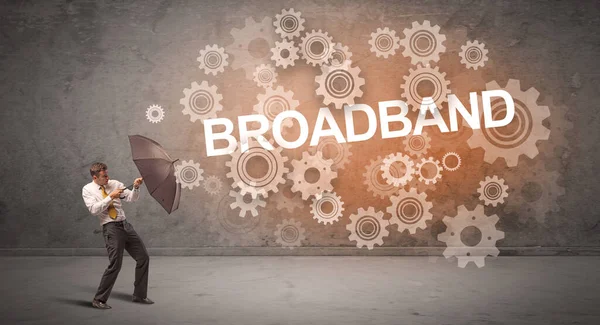 Empresario Defendiendo Con Paraguas Broadband Inscripción Concepto Tecnología —  Fotos de Stock
