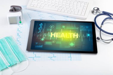 HEALTH yazıtlı tablet bilgisayar ve tıbbi malzemeler, önleme kavramı