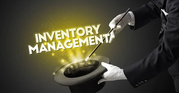 Illusionist is showing magic trick with INVENTORY MANAGEMENT inscription, new business model concept