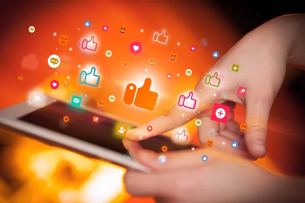 Close Hand Using Tablet Colorful Icons Coming Out Social Networking — Stock Photo, Image