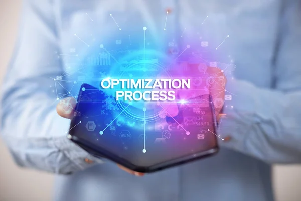 Empresario Sosteniendo Smartphone Plegable Con Inscripción Optimization Process Nuevo Concepto — Foto de Stock