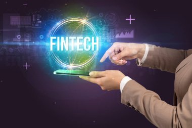 FINTECH yazıtları ve yeni teknoloji konseptiyle dokunmatik ekranın yakın plan görüntüsü