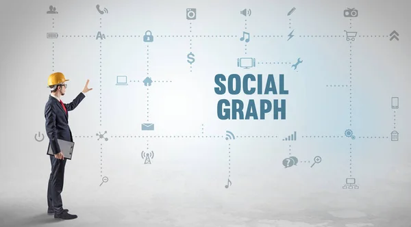 Engineer working on a new social media platform with SOCIAL GRAPH inscription concept