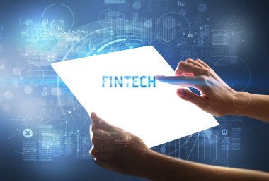 FINTECH yazıtlı el yapımı fütüristik tablet, yeni teknoloji kavramı