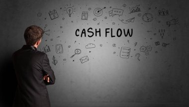 CASH FLOW yazıtları ve iş stratejisi konseptiyle yaratıcı bir fikir çizimi yapan işadamı.