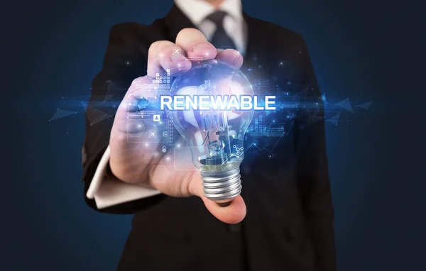 Geschäftsmann Hält Glühbirne Mit Renewable Beschriftung Innovatives Technologiekonzept — Stockfoto