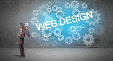 WeB DESIGN yazıtları ve teknoloji kavramından şemsiyeyle savunma yapan iş adamı