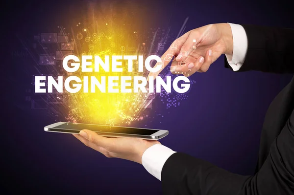 Close-up of a touchscreen with GENETIC ENGINEERING inscription, innovative technology concept