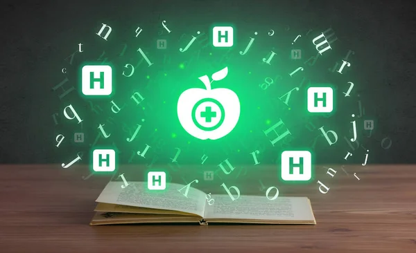 Open medical book with healthy apple icons above, global health concept