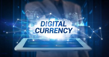 Tablet üzerinde çalışan genç iş adamı ve yazıyı gösteriyor: Dijital CURRENCY