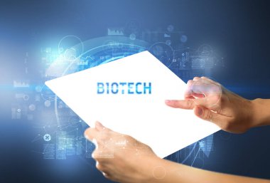 BIOTECH yazıtlı el işi fütüristik tablet, yeni teknoloji kavramı