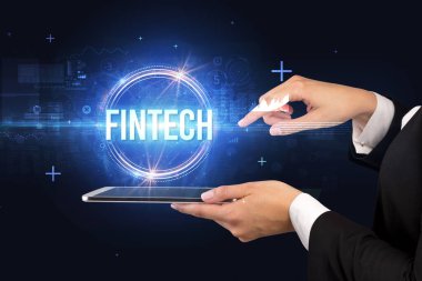 FINTECH yazıtları ve yeni teknoloji konseptiyle dokunmatik ekranın yakın plan görüntüsü