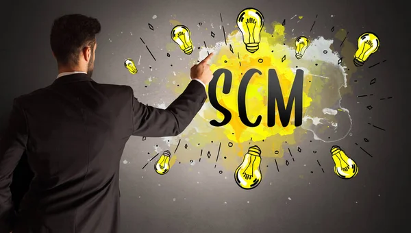 Businessman Drawing Colorful Light Bulb Scm Abbreviation New Technology Idea — Stock Photo, Image