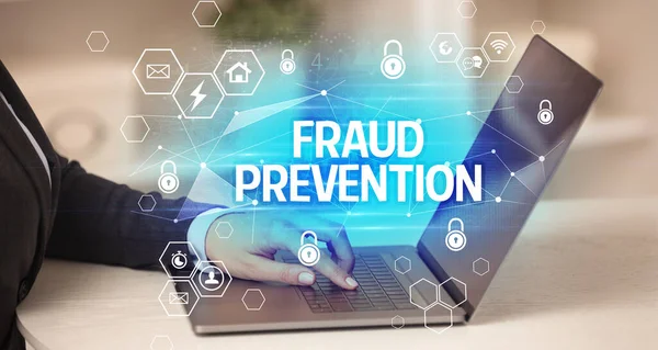 FRAUD PREVENTION inscription on laptop, internet security and data protection concept, blockchain and cybersecurity