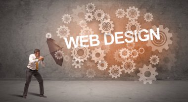 WeB DESIGN yazıtları ve teknoloji kavramından şemsiyeyle savunma yapan iş adamı