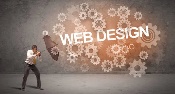 Webデザイン碑文から傘で守るビジネスマン 技術コンセプト — ストック写真