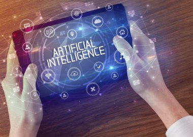 ARTIFICIAL INTELLIGENCE yazıtlı, yenilikçi teknoloji kavramına sahip bir tabletin yakın çekimi